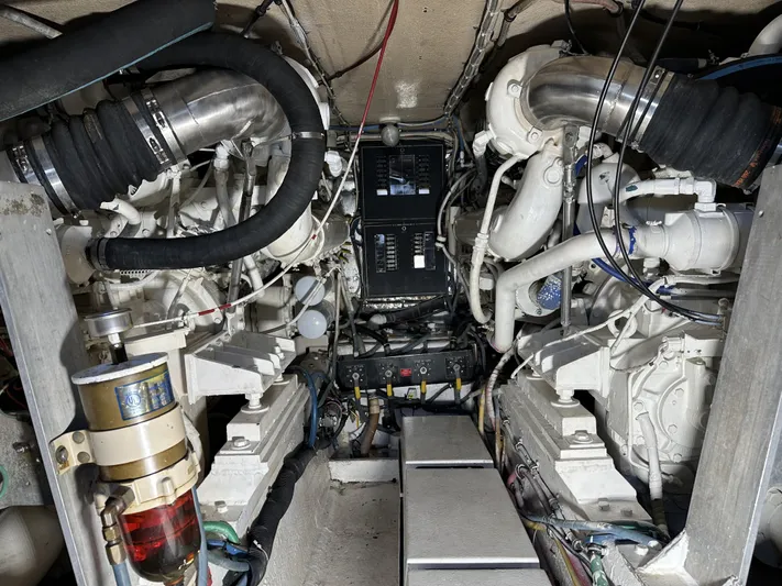 50 Hatteras Convertible Yacht Photos Pics Engine room of a 1992 Hatteras 50 Convertible yacht with twin engines and control panel.