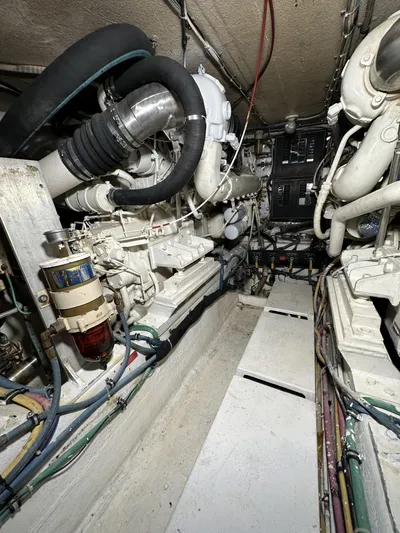 50 Hatteras Convertible Yacht Photos Pics Engine room of a 1992 Hatteras 50 Convertible yacht, showcasing mechanical components.