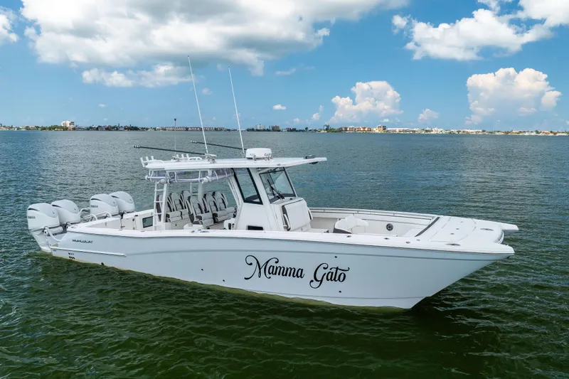 Mama Gato Yacht Photos Pics 2022 World Cat 400 CC-X boat on water, clear sky background.