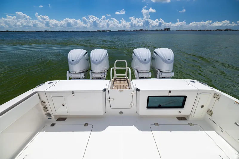 Mama Gato Yacht Photos Pics 2022 World Cat 400 CC-X boat with four engines on open water.