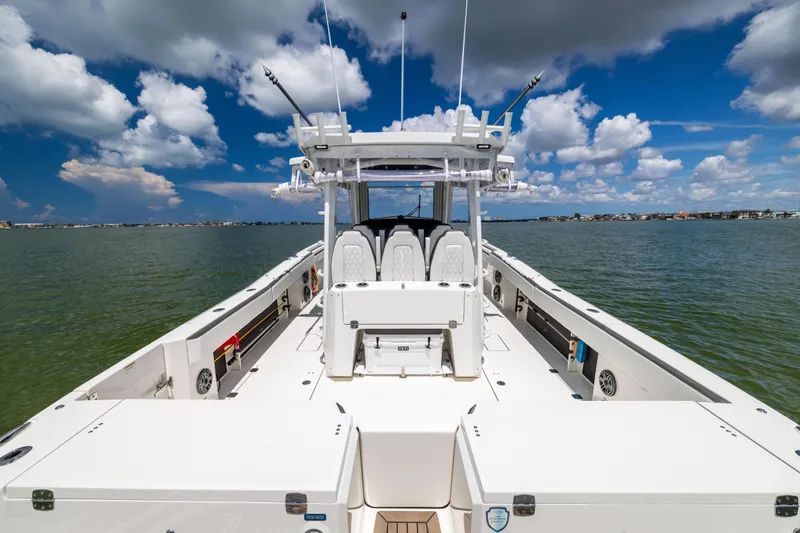 Mama Gato Yacht Photos Pics 2022 World Cat 400 CC-X boat on water under blue sky with clouds.