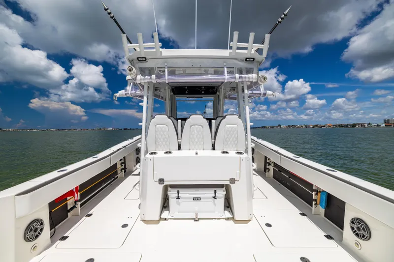 Mama Gato Yacht Photos Pics 2022 World Cat 400 CC-X boat on water under blue sky with clouds.