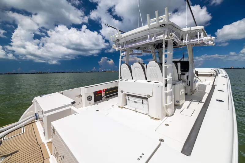 Mama Gato Yacht Photos Pics 2022 World Cat 400 CC-X boat on water under a partly cloudy sky.