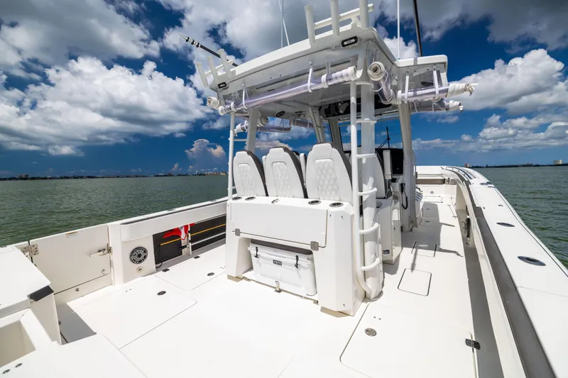 Mama Gato Yacht Photos Pics 2022 World Cat 400 CC-X boat on water, featuring spacious deck and seating.