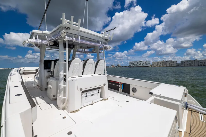 Mama Gato Yacht Photos Pics 2022 World Cat 400 CC-X boat on water under blue sky with clouds.