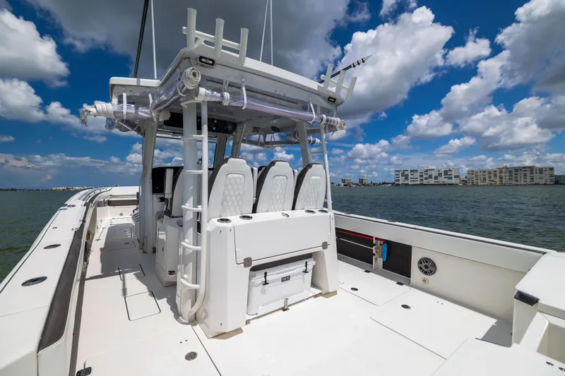 Mama Gato Yacht Photos Pics 2022 World Cat 400 CC-X boat on water under blue sky with clouds.