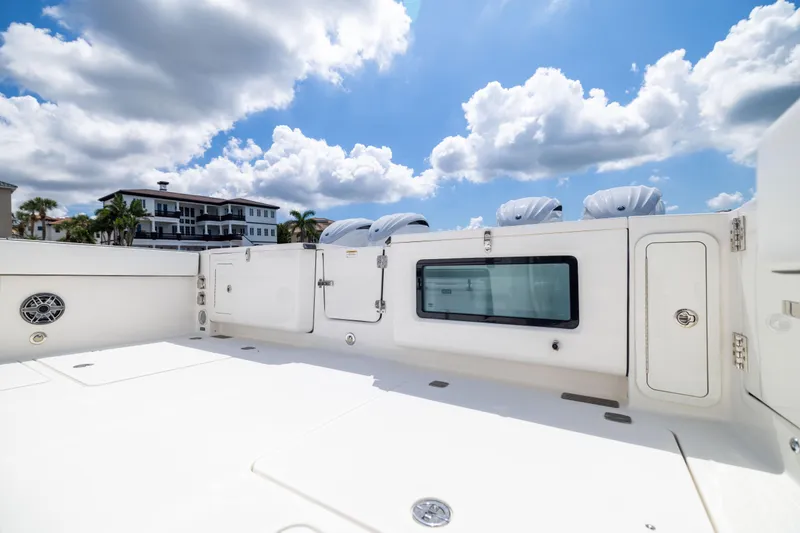 Mama Gato Yacht Photos Pics 2022 World Cat 400 CC-X boat deck under a bright blue sky with clouds.