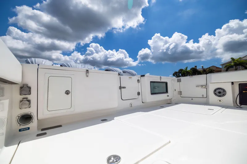 Mama Gato Yacht Photos Pics 2022 World Cat 400 CC-X boat deck under a bright blue sky with clouds.