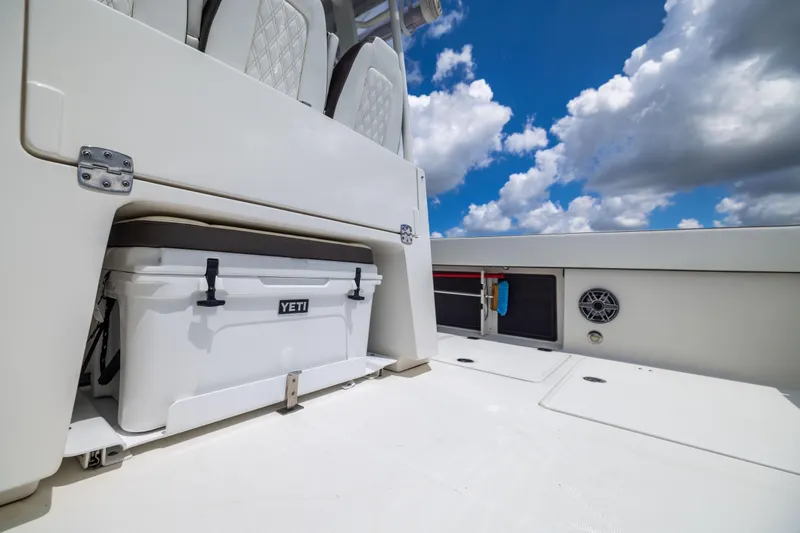 Mama Gato Yacht Photos Pics 2022 World Cat 400 CC-X boat deck with Yeti cooler under blue sky.
