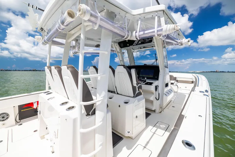 Mama Gato Yacht Photos Pics 2022 World Cat 400 CC-X boat interior with helm, seats, and ocean view.
