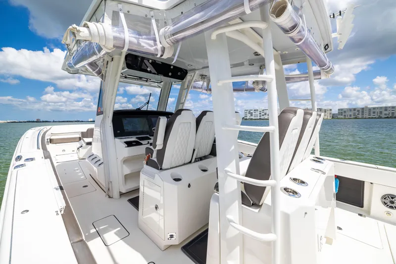 Mama Gato Yacht Photos Pics 2022 World Cat 400 CC-X boat interior with helm, seats, and ocean view.