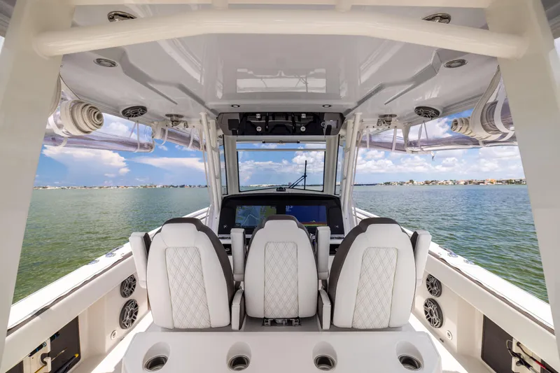Mama Gato Yacht Photos Pics Interior view of 2022 World Cat 400 CC-X boat with luxurious seating and ocean backdrop.
