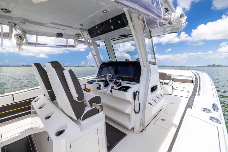 Mama Gato Yacht Photos Pics 2022 World Cat 400 CC-X boat interior with helm, seats, and ocean view.