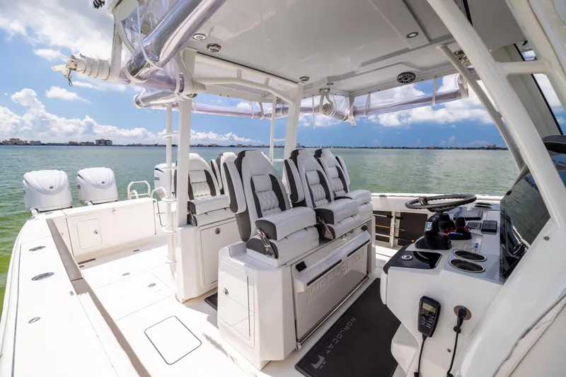 Mama Gato Yacht Photos Pics 2022 World Cat 400 CC-X boat interior with luxurious seating and modern controls on open water.