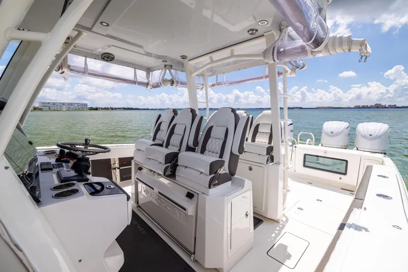 Mama Gato Yacht Photos Pics 2022 World Cat 400 CC-X boat interior with luxurious seating and modern helm.