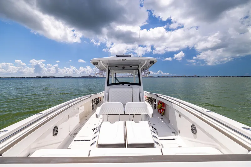 Mama Gato Yacht Photos Pics 2022 World Cat 400 CC-X boat on open water under a partly cloudy sky.