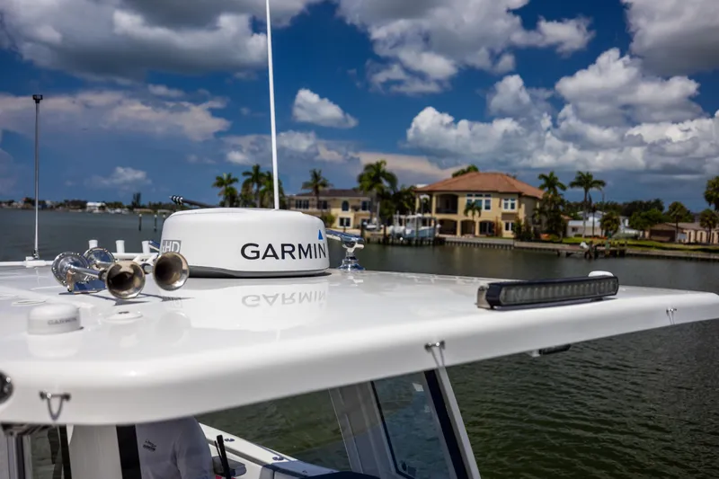 Mama Gato Yacht Photos Pics 2022 World Cat 400 CC-X boat with Garmin radar, scenic waterfront view.