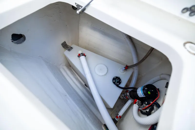 Mama Gato Yacht Photos Pics 2022 World Cat 400 CC-X boat compartment with water tank and pump system.