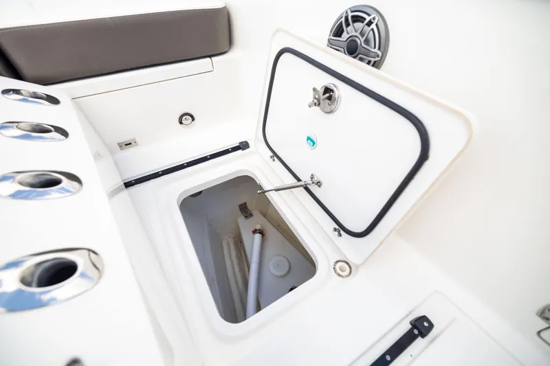 Mama Gato Yacht Photos Pics 2022 World Cat 400 CC-X boat storage compartment with open hatch and rod holders.