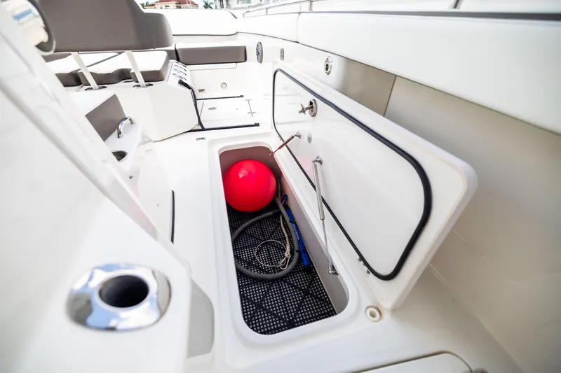 Mama Gato Yacht Photos Pics Storage compartment on 2022 World Cat 400 CC-X boat with red buoy and rope.