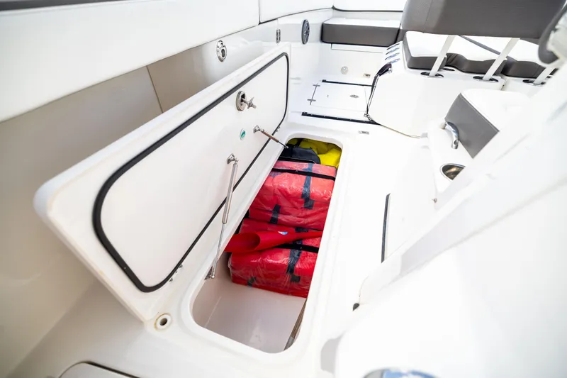 Mama Gato Yacht Photos Pics 2022 World Cat 400 CC-X boat storage compartment with red life jackets.