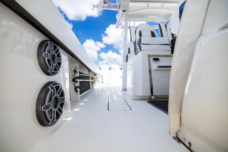 Mama Gato Yacht Photos Pics 2022 World Cat 400 CC-X boat interior with speakers and seating, under a blue sky.