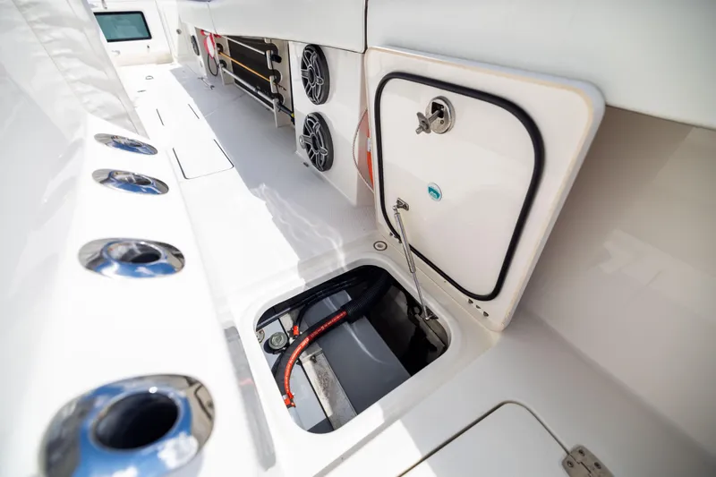 Mama Gato Yacht Photos Pics 2022 World Cat 400 CC-X boat interior with storage compartments and speakers.