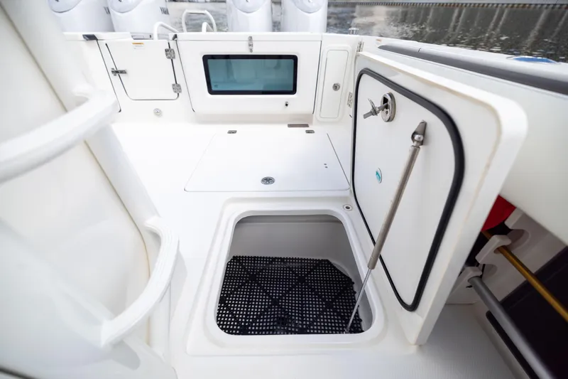 Mama Gato Yacht Photos Pics 2022 World Cat 400 CC-X boat interior with storage compartments and sleek design.