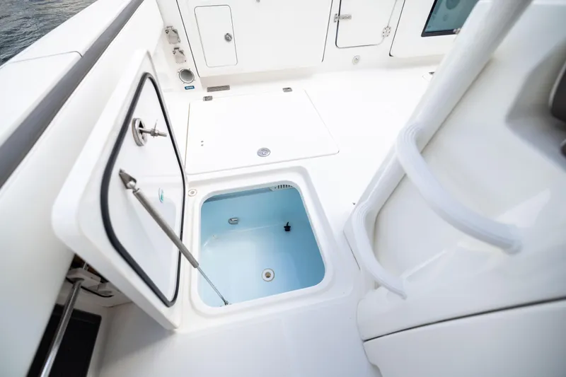 Mama Gato Yacht Photos Pics 2022 World Cat 400 CC-X boat interior with open storage compartment.