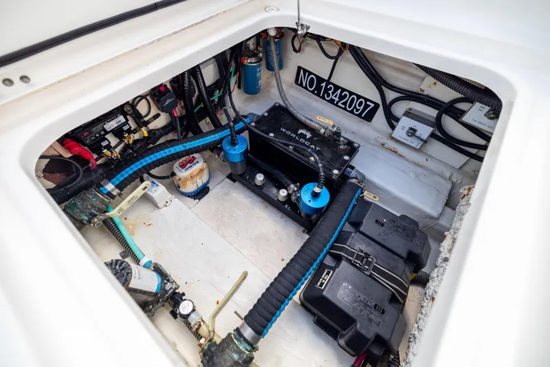Mama Gato Yacht Photos Pics Engine compartment of 2022 World Cat 400 CC-X boat, showcasing wiring and components.