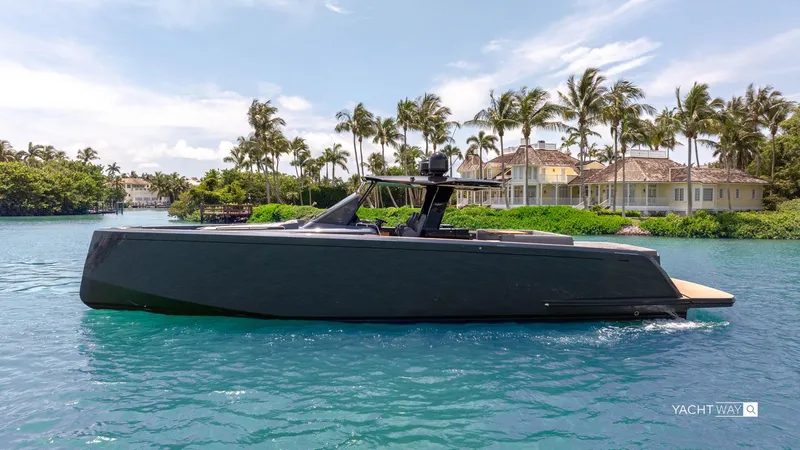 Available Now Yacht Photos Pics 2025 Pardo Yachts P50 cruising on a tropical waterway with palm trees in the background.