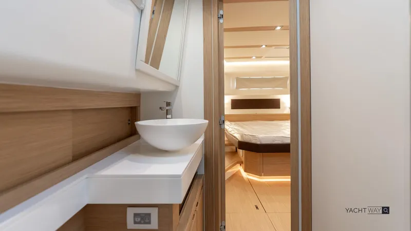 Available Now Yacht Photos Pics Luxurious interior of 2025 Pardo Yachts P50, featuring modern bathroom and cozy bedroom.