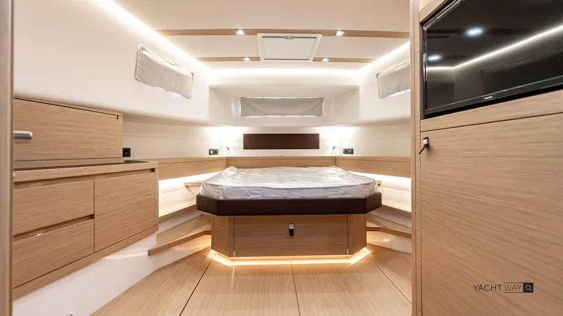 Available Now Yacht Photos Pics Luxurious interior of 2025 Pardo Yachts P50, featuring modern wood finishes and ambient lighting.