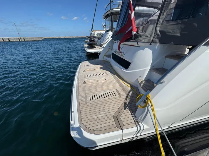  Yacht Photos Pics Luxury Princess F55 yacht docked at marina, featuring sleek design and spacious deck, 2020 model.