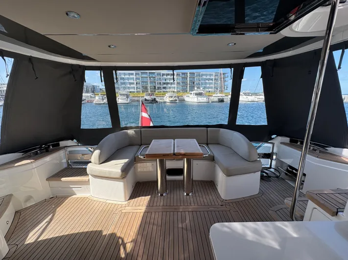  Yacht Photos Pics Luxurious 2020 Princess F55 yacht interior with elegant seating and marina view.