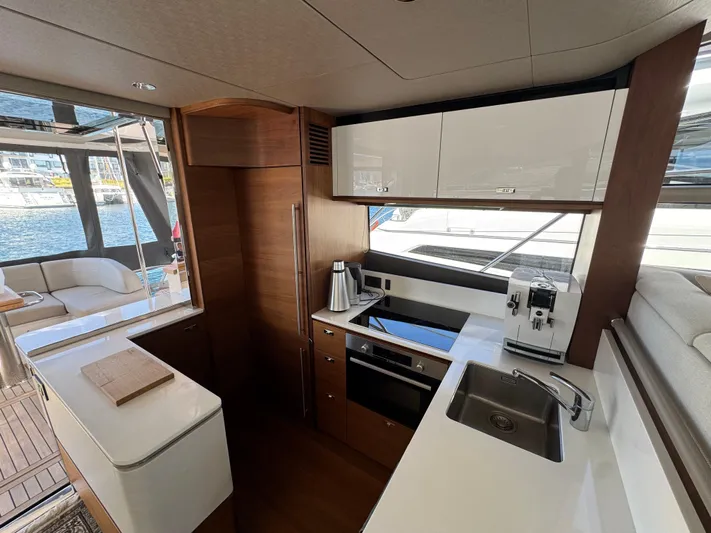  Yacht Photos Pics Luxurious 2020 Princess F55 yacht kitchen with modern appliances and sleek design.