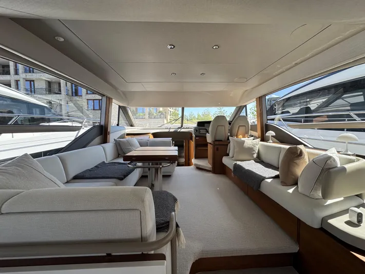  Yacht Photos Pics Luxurious interior of a 2020 Princess F55 yacht with elegant seating and modern design.