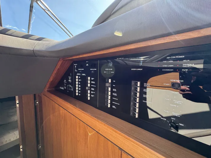  Yacht Photos Pics Control panel of a 2020 Princess F55 yacht, featuring various system switches and indicators.