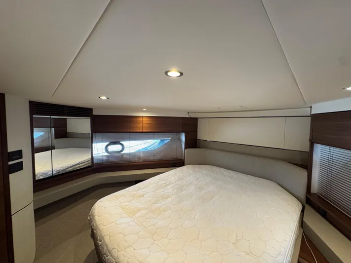  Yacht Photos Pics Luxurious bedroom interior of 2020 Princess F55 yacht with modern design and cozy bedding.