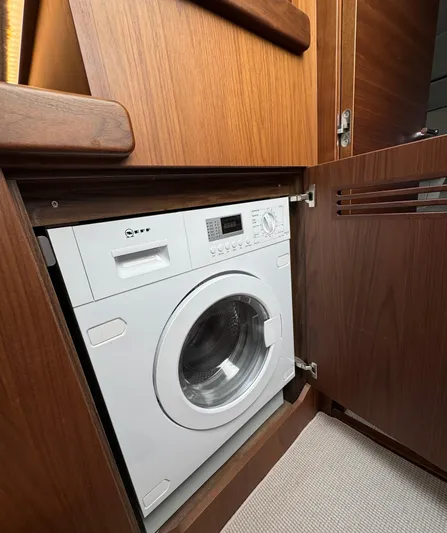  Yacht Photos Pics Washing machine in wooden cabinet on Princess F55 yacht, 2020 model.