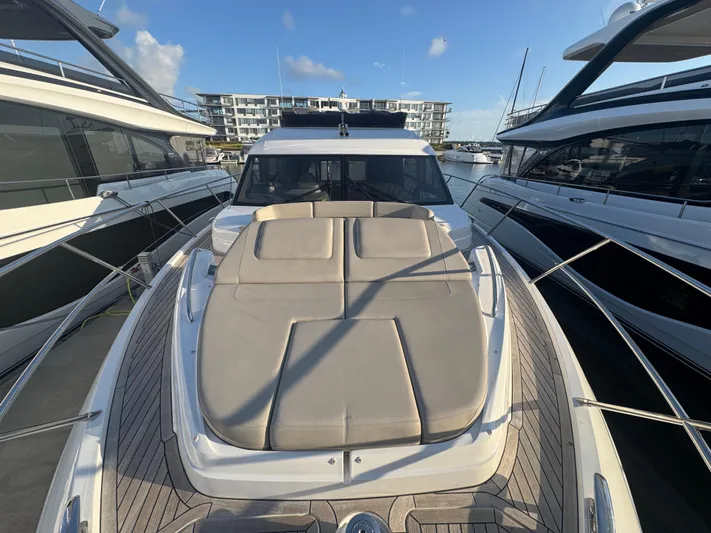 Yacht Photos Pics Luxury Princess F55 yacht, 2020 model, docked with sunbed on deck.