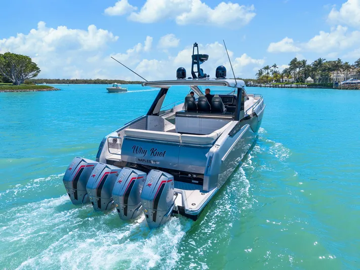 Why Knot Yacht Photos Pics Azimut 47 VERVE 2022 luxury yacht cruising on turquoise waters under a clear blue sky.