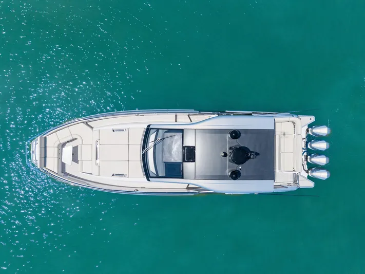 Why Knot Yacht Photos Pics Aerial view of 2022 Azimut 47 VERVE yacht on turquoise water.