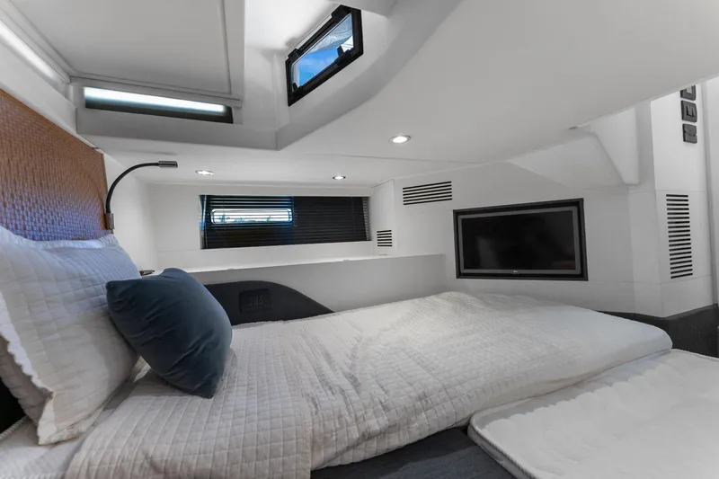 Why Knot Yacht Photos Pics Luxurious cabin interior of 2022 Azimut 47 VERVE yacht with modern amenities.