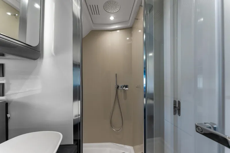 Why Knot Yacht Photos Pics Modern bathroom interior on 2022 Azimut 47 VERVE yacht, featuring sleek shower design.