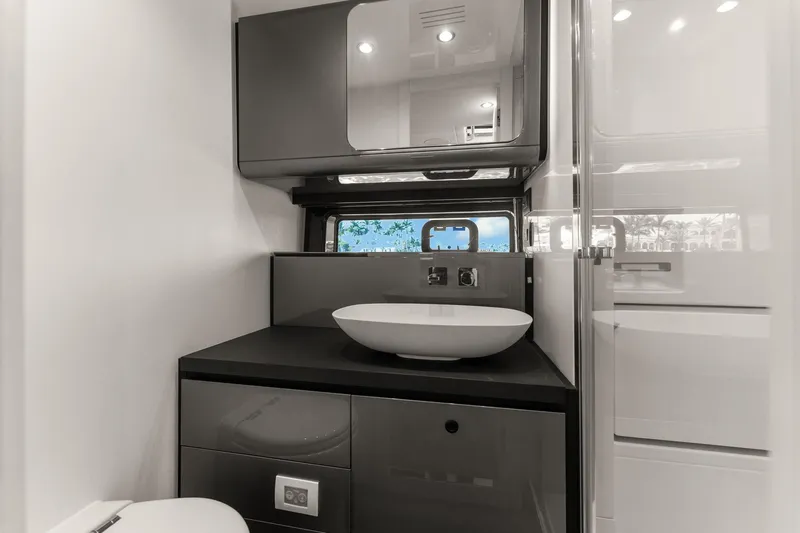 Why Knot Yacht Photos Pics Modern bathroom in 2022 Azimut 47 VERVE yacht with sleek fixtures and elegant design.