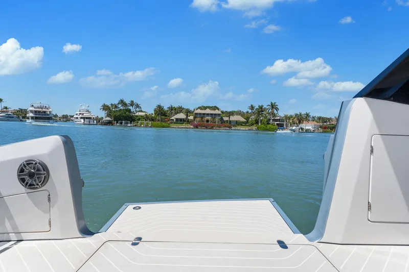 Why Knot Yacht Photos Pics Azimut 47 VERVE 2022 yacht deck with scenic waterfront view.