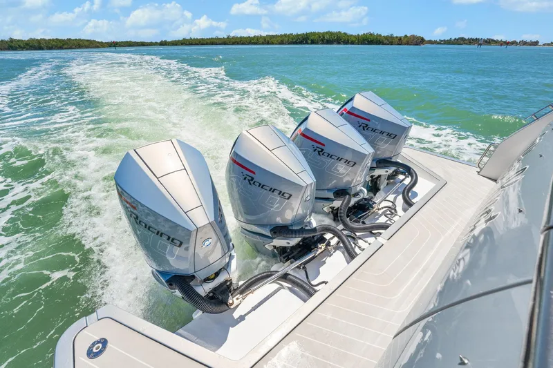 Why Knot Yacht Photos Pics Azimut 47 VERVE 2022 with triple outboard engines cruising on open water.