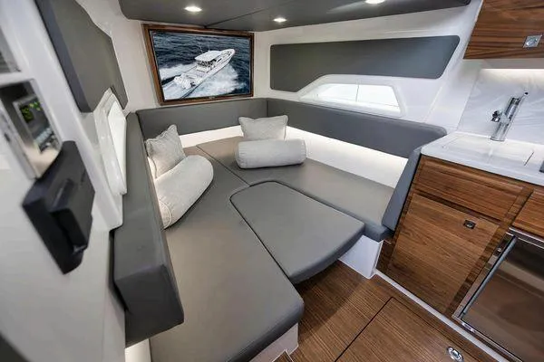  Yacht Photos Pics 2023 Valhalla Boatworks V-46 interior with modern seating and wood accents.
