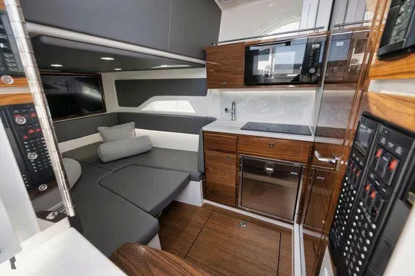  Yacht Photos Pics 2023 Valhalla V-46 boat interior with modern kitchen and seating area.